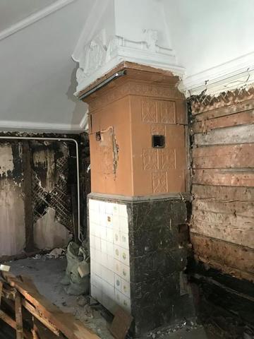 Под листами гипсокартона реставраторы нашли печь